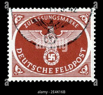 GERMANY - CIRCA 1942: German historical postage stamp: Imperial eagle with swastika, feldpost, for packages weighing up to 1 kg, postmarked, ww2 Stock Photo