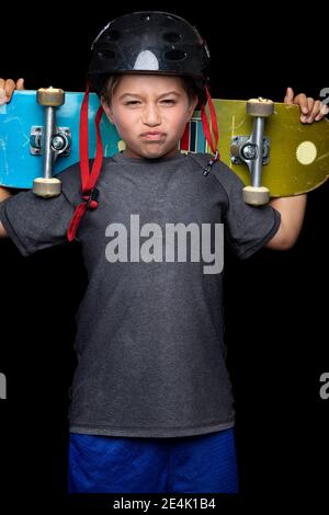 Profile of boy with skateboard Stock Photo