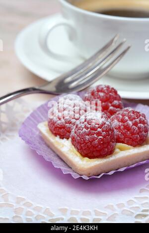 Patisserie with raspberries and coffee cup Stock Photo