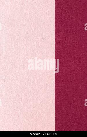 pink and burgundy knitted texture. Clothes background. Stock Photo