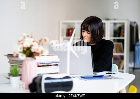 Young female student with concentration studying in study room Stock Photo