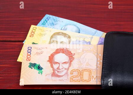 Costa Rican colon in the black wallet Stock Photo