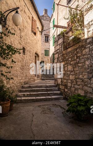 Narrow alley in old town Stock Photo