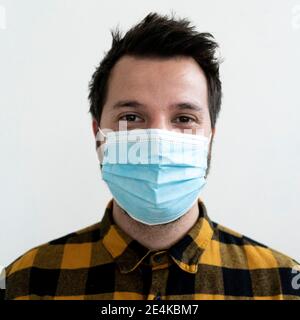 Studio portrait of man wearing face mask Stock Photo