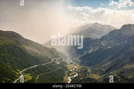 Storm clouds over mountain and valley with river Stock Photo