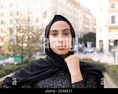 Portrait of young beautiful woman wearing black hijab Stock Photo