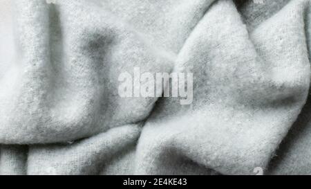 delicate blue fluffy background of plush fabric with folds Stock Photo