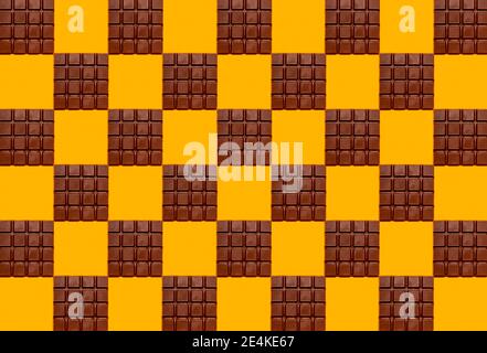 Pattern of chocolate bars against yellow background Stock Photo