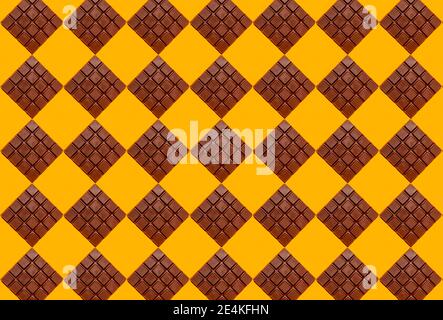 Pattern of chocolate bars against yellow background Stock Photo