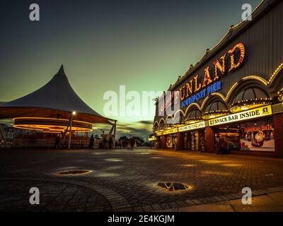 Evening lights at the end of Southport pier showing a traditional seaside scene Stock Photo