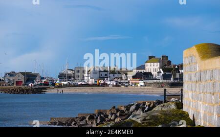 Lyme Regis, Dorset, UK. 24th Jan, 2021. UK Weather: A bright, sunny and cold day at the seaside resort town of Lyme Regis during the third national lockdown. Credit: Celia McMahon/Alamy Live News Stock Photo
