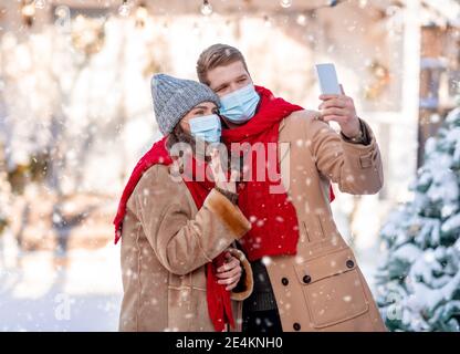 Boyfriend and girlfriend face mask hi-res stock photography and