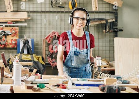 Carpenter using pneumatic stapler Stock Photo