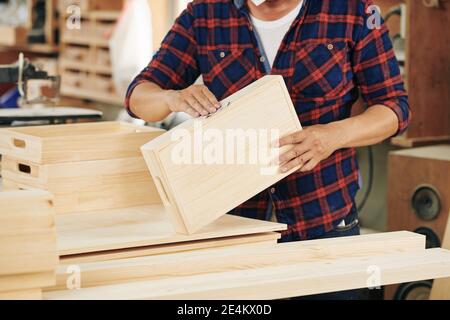 Working with sandpaper Stock Photo