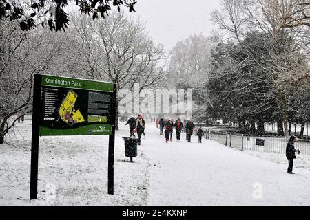 Kennington Park, London, UK. 24th January 2021. People walking in Kennington Park (near south entrance)  at the during heavy snow fall in London, UK. Credit: Harrison Hodgkins/Alamy Live News. Stock Photo