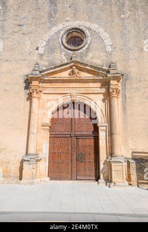 Exterior door, columns and reliefs, in church of Santa Cristina, renaissance style landmark and public monument from sixteenth century, in Burgo de Os Stock Photo