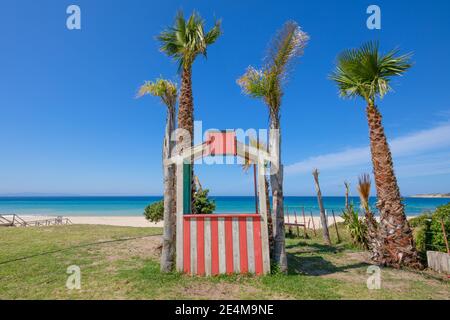 little red lonely cabin next to tall mountain and seashore Stock Photo ...