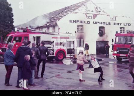 Fire Brigade attending the Enfield Upholstery fire when the factory burnt down in the early 1980s. Church Street, Princes Risborough, Buckinghamshire, UK. Stock Photo