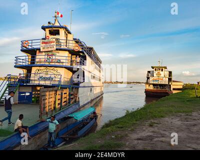 Santa Rosa, Peru - December 04 , 2018: View of two slow boats 'Maria fernanda' And 'don Manuel' in the small port on the Amazon River. Amazonia. South Stock Photo