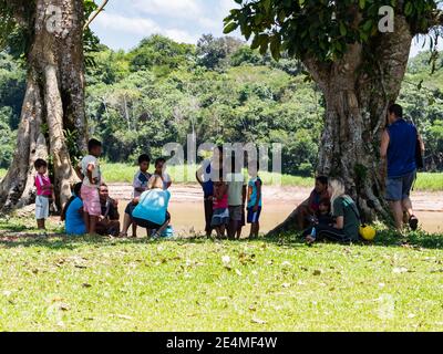 Santa Rita, Peru - Sep 19, 2018: People in a small village on the bank of the Javari rIver, tributary of Amazon River. Amazonia. South America Stock Photo