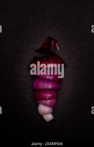 Red onion on black background, flat lay concept vegetable Stock Photo