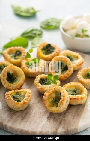 Spinach mini quiches freshly baked Stock Photo