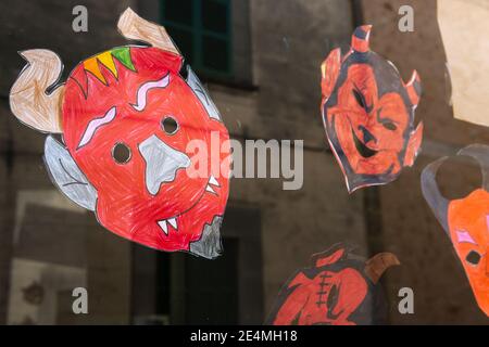 Cildren's masks of the devil's face, typical of the Sant Antoni festivities on the island of Mallorca, Spain Stock Photo