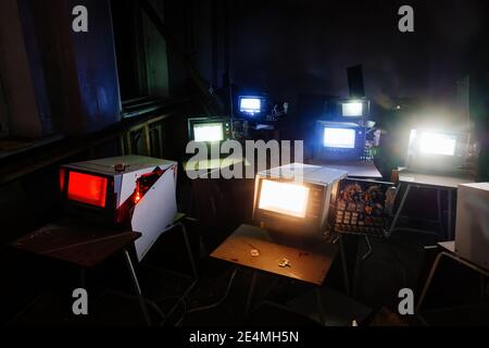 Old broken Soviet computers in abandoned computer hall. Stock Photo