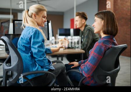 Cheerful IT specialists in office, success work Stock Photo