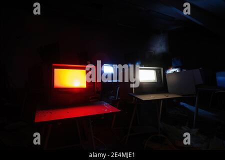 Old broken Soviet computers in abandoned computer hall. Stock Photo