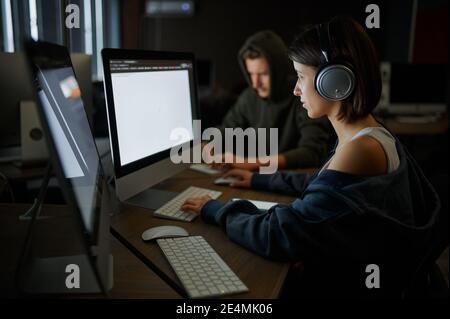 Internet hackers works on computers, teamwork Stock Photo