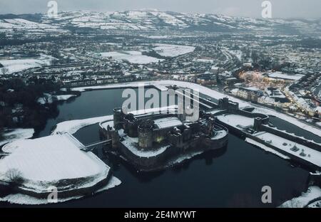 Caerphilly Castle surrounded by snow in South Wales, UK Stock Photo