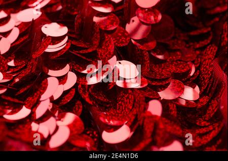 Sparkling sequins. Red sequin fabric for background. rectangular red shiny fabric, Christmas Stock Photo