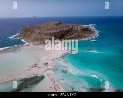 Crete Greece, Balos lagoon on Crete island, Greece. Tourists relax and bath in crystal clear water of Balos beach. Greece Stock Photo