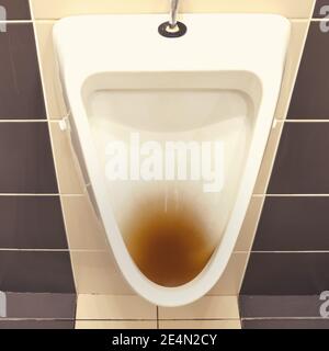 Clogged toilet bowl with water in a cafe toilet. Blockage problems in the bathroom and toilet Stock Photo