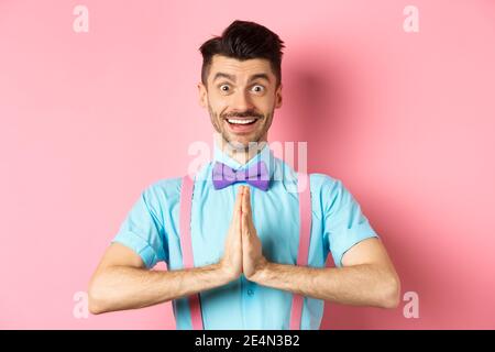 Handsome caucasian man say thank you, bowing with namaste gesture ...