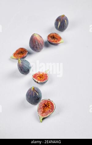 Whole fig and fig slices on a white background Stock Photo