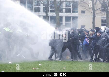 Amsterdam, Netherlands. 24th Jan, 2021. Dutch anti-riot police use water cannon to disperse an illegal anti-lockdown demonstration at the Museumplein amid the coronavirus pandemic on January 24, 2021 in Amsterdam, Netherlands. (Photo by Paulo Amorim/Sipa USA) Credit: Sipa USA/Alamy Live News Stock Photo