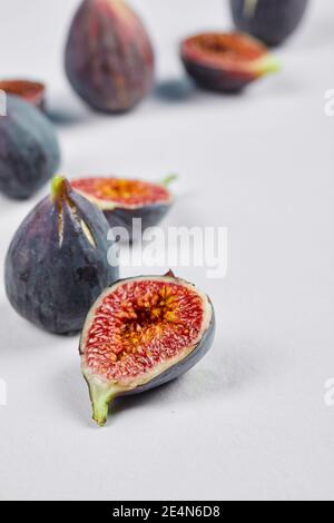 Whole fig and fig slices on a white background Stock Photo