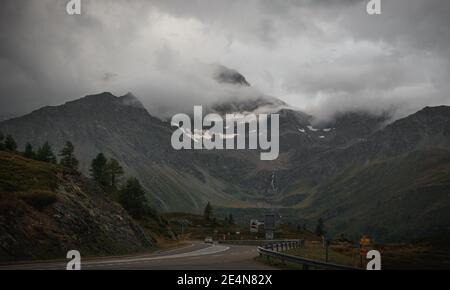 alpine mountain in the clouds dark moody look, cloudy rainy, evening hiking Stock Photo