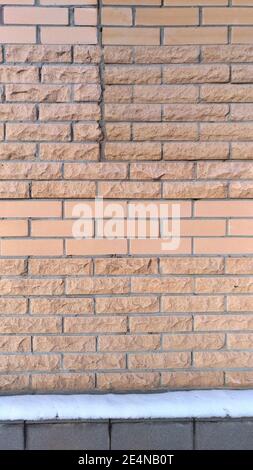 Wall lined with different decorative brick tiles Stock Photo