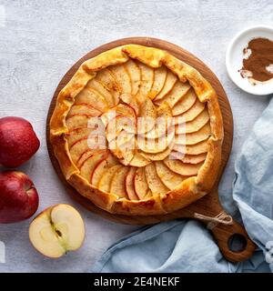 Apple pie, galette with fruits, sweet pastries on gray backdrop, sweet crostata Stock Photo