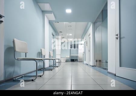 Empty modern hospital corridor, clinic hallway interior background. Stock Photo