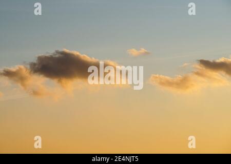 clouds on orange sunset sky background Stock Photo