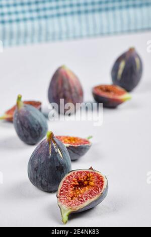 Whole fig and fig slices on a white background Stock Photo