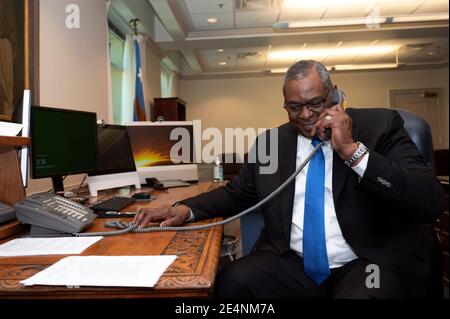 Arlington, United States Of America. 23rd Jan, 2021. U.S. Secretary of Defense Lloyd J. Austin III, talks via speaker phone with British Secretary of State for Defense Ben Wallace from the Pentagon January 22, 2021 in Arlington, Virginia. Austin was earlier confirmed and sworn in as the first African-American secretary of defense. Credit: Planetpix/Alamy Live News Stock Photo