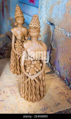 Unfired clay dolls, known as Muñecas Limé or Lime Doll, wait to be fired and then painted in beautiful colors near El Higuerito, Dominican Republic. Stock Photo