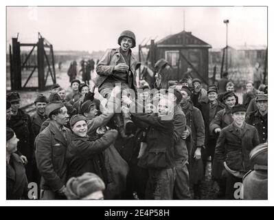 ESELHEIDE LIBERATION WW2 Nazi Concentration Camp Liberation Russian prisoners of war lifting up an American soldier after the US 9th Army liberated them from their camp at Eselheide Germany 9th April 1945 Stock Photo