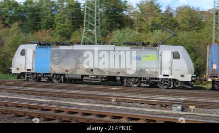 A Traxx Railpool electric powered locomotive with iso container wagons at Cologne-Gremberg, Germany, Europe. Stock Photo