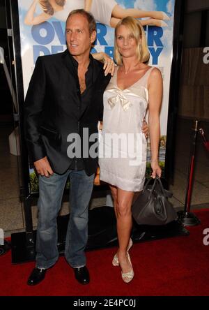 Michael Bolton and girlfriend Nicollette Sheridan attend the premiere
